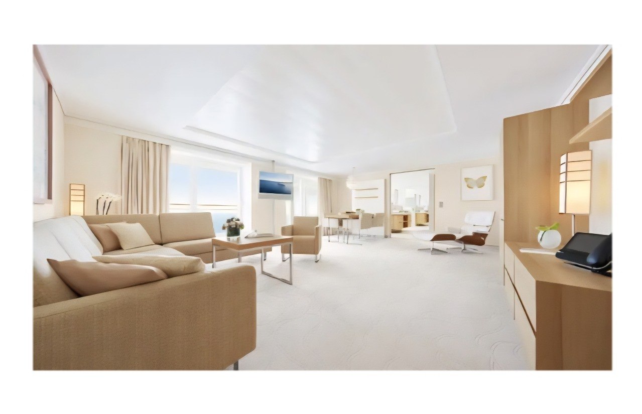 Private suite balcony with jacuzzi overlooking the sea at sunset